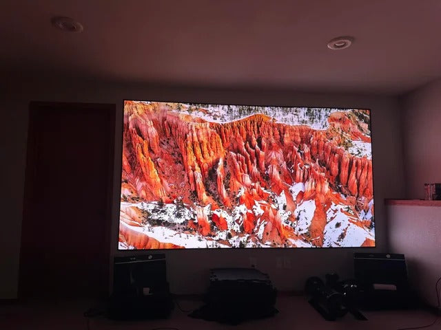 Customer photo of a 130-inch WUPRO Ultra Contrast anti-laser speckle lenticular CLR projection screen paired with a Valerion projector in a dark room